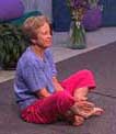 woman cross legged on floor